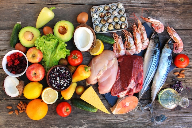 Healthy food on old wooden table. Concept of proper nutrition. Top view. Flat lay.