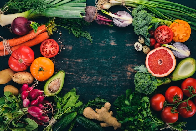 Healthy food Vegetables and fruits On a black wooden background Top view Copy space