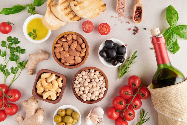 Healthy food. Vegetables, lemon and chickpeas on concrete surface, Vegetarian food or Mediterranean cuisine concept, copy space. Fruit, vegetables, grain, nuts olive oil on wooden table.