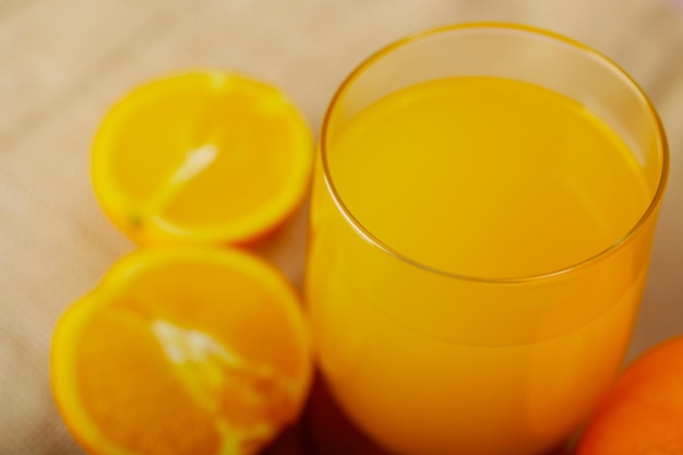 Healthy glass of juice, made with oranges.