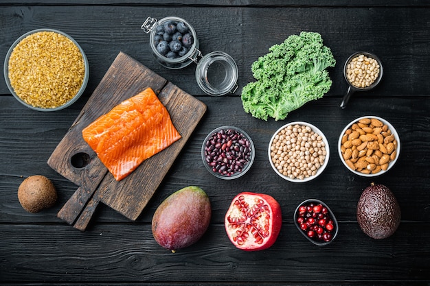 Healthy ingredients on dark wooden background