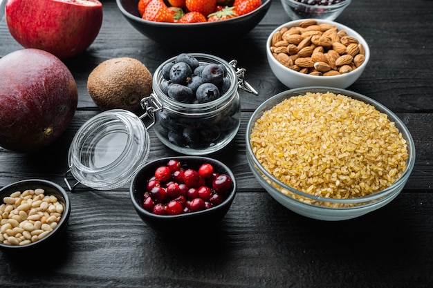 Healthy ingredients on dark wooden background