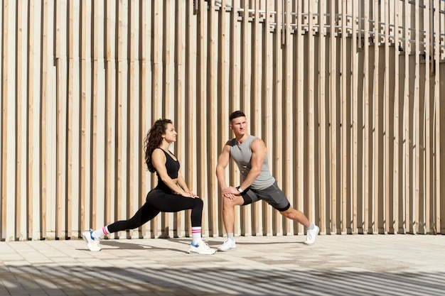 Healthy lifestyle fitness Male and female engaged in active sports fitness on the street