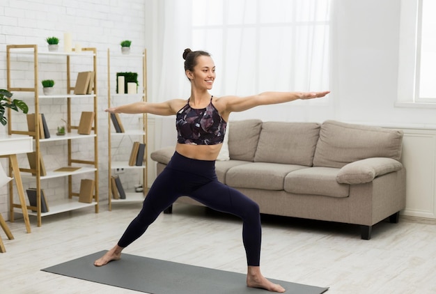 Healthy Lifestyle Woman Making Yoga Warrior Pose