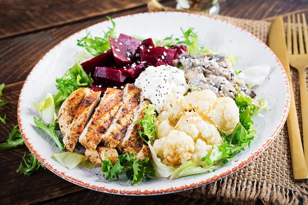 Healthy lunch Boiled beetroot salad with greens stewed mushrooms  and grilled chicken fillet and baked cauliflower Dinner