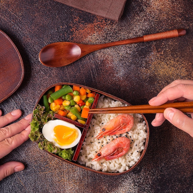 Healthy lunch in wooden japanese bento box