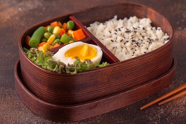 Healthy lunch in wooden japanese bento box