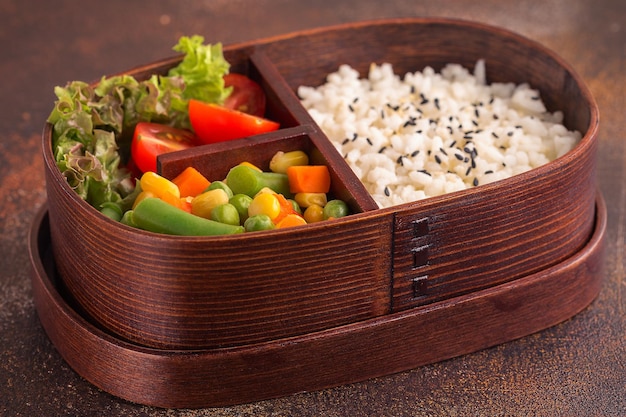 Healthy lunch in wooden japanese bento box