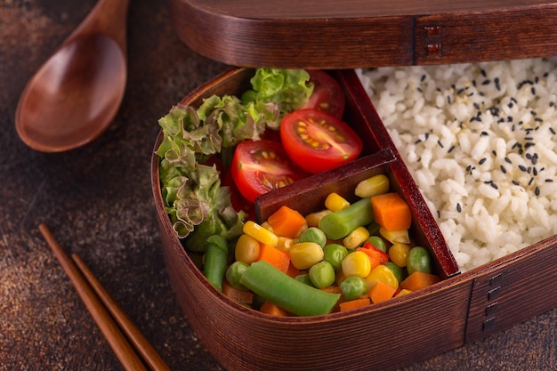 Healthy lunch in wooden japanese bento box