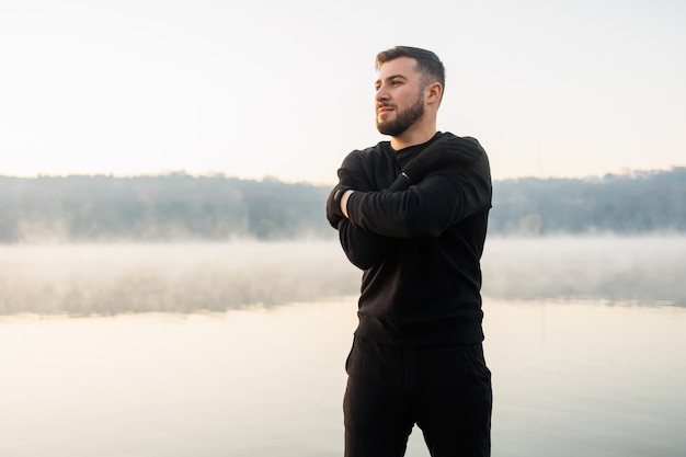 Healthy man doing sport in summer morning Fit lifestyle Man doing workout and exercises outside