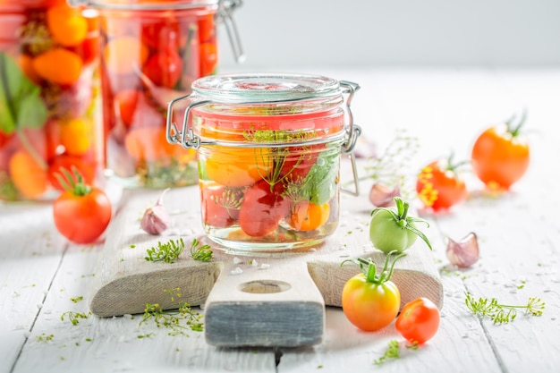 Healthy pickled tomatoes with vegetables from greenhouse