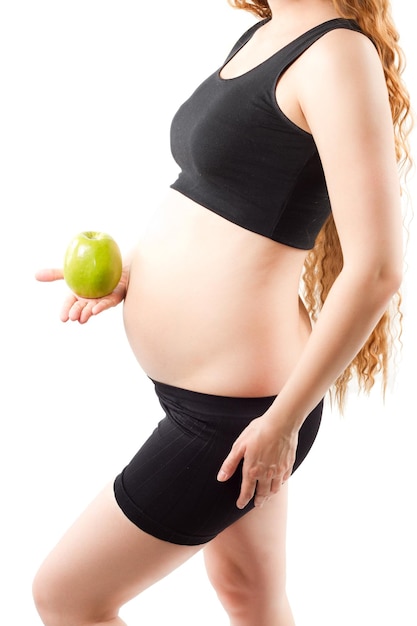 Photo healthy pregnant woman with green apple over white diet and organic nutrition concept