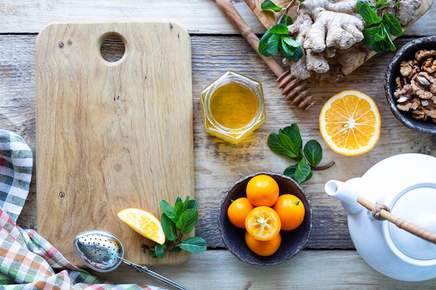 Healthy products for Immunity boosting on wooden background with copy space top view. Lemon, nuts, ginger to immune system