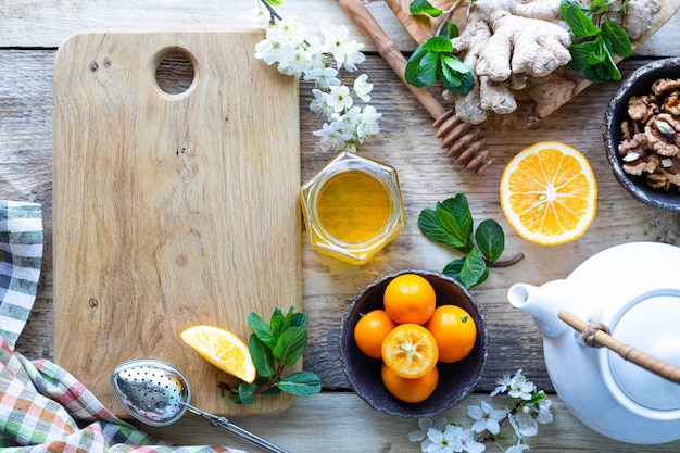 Healthy products for Immunity boosting on wooden background with copy space top view. Lemon, nuts, ginger to immune system