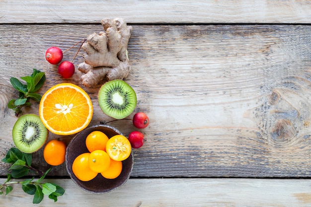 Healthy products for Immunity boosting on wooden background with copy space top view. Lemon, nuts, ginger to immune system