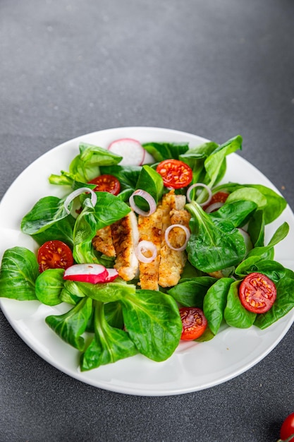 healthy salad chicken meat, vegetables, tomato, radish, green leaves mix lettuce healthy meal food