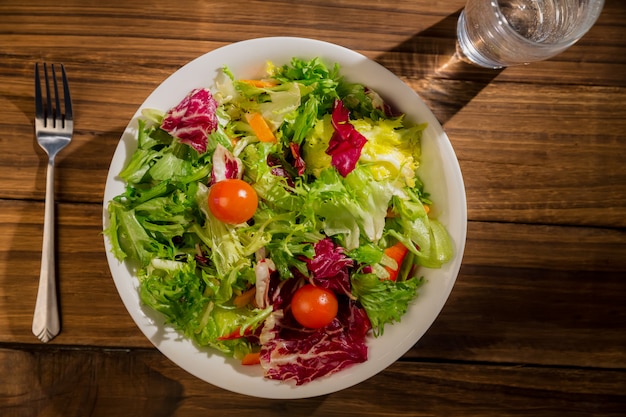 Healthy salad and glass of water