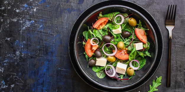 healthy salad olives, lettuce, tomato and cheese feta