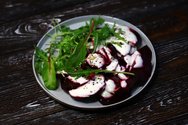 Healthy salad with beets and arugula with yogurt dressing Vegan style food