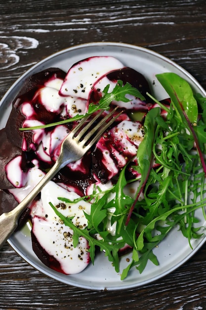 Healthy salad with beets and arugula with yogurt dressing Vegan style food