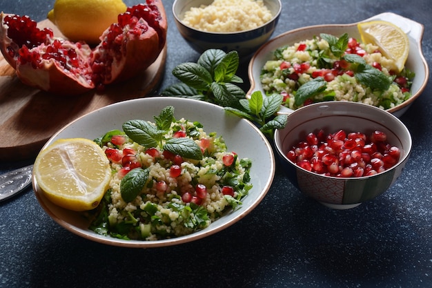 Healthy salad with couscous fresh mint cucumber pomegranate lemon and olive oil