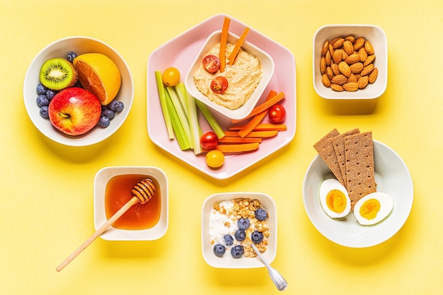 Healthy snack on a pastel background, top view.