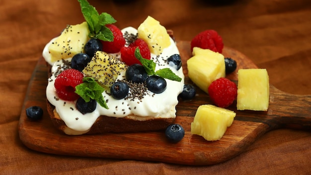 Photo healthy sweet toast with cream cheese fruits berries and chia seeds keto dessert