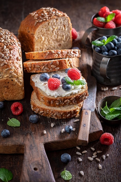 Healthy and sweet whole grain bread with blueberries and raspberries