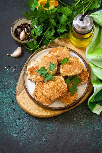 Healthy vegan food Red fish cutlets on a dark stone or slate table Copy space