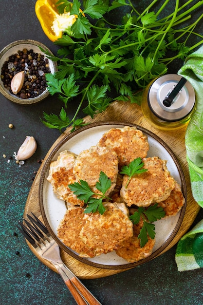 Healthy vegan food Red fish cutlets on a dark stone or slate table Top view flat lay background