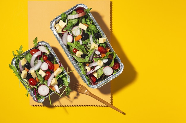 Healthy vegan Take away salad in aluminum container or food delivery. From above