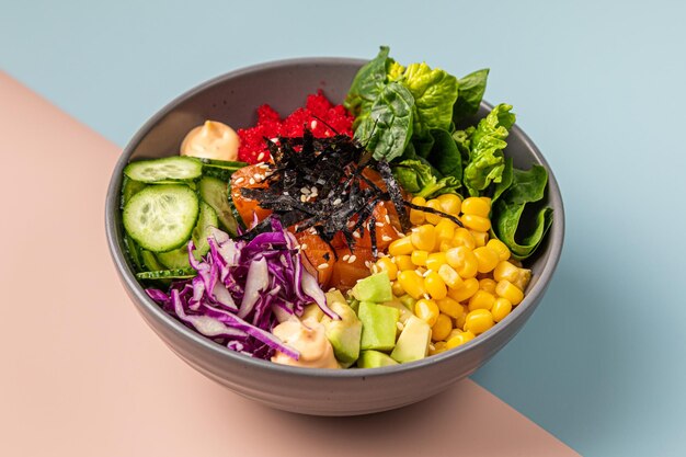 Healthy vegetable salad in black bowl green salad Buddha bowl Slate background