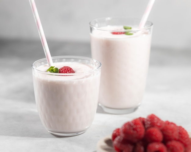 Healthy vitamin breakfast concept, milk yogurt cocktail with raspberry