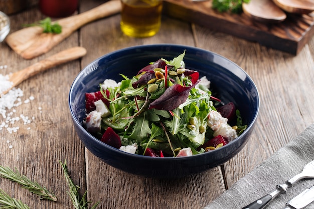 Healthy vitamin salad with beetroot cheese greens