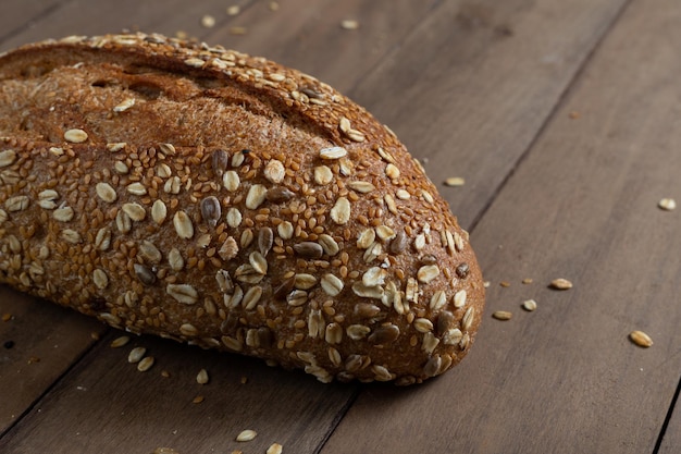 Healthy Whole Grain Loaf Bread Artisanal on a wooden table Copy Space