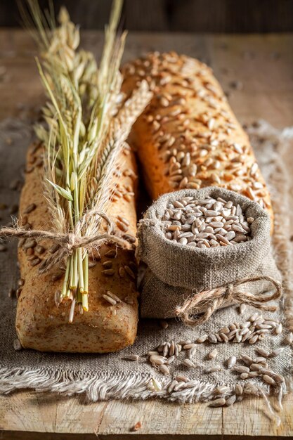 Healthy and wholegrains oat buns with ears of grains