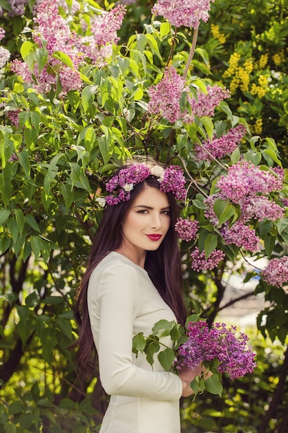 Healthy woman outdoors Summer female model with flowers