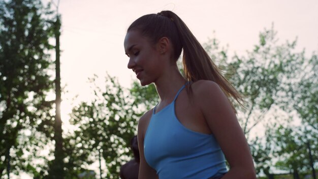 Healthy young players practicing street basketball in sport playground