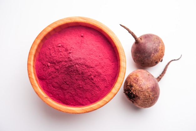 Heap of Beetroot or Beet Root powder with raw whole contains the essential minerals iron, potassium, and magnesium