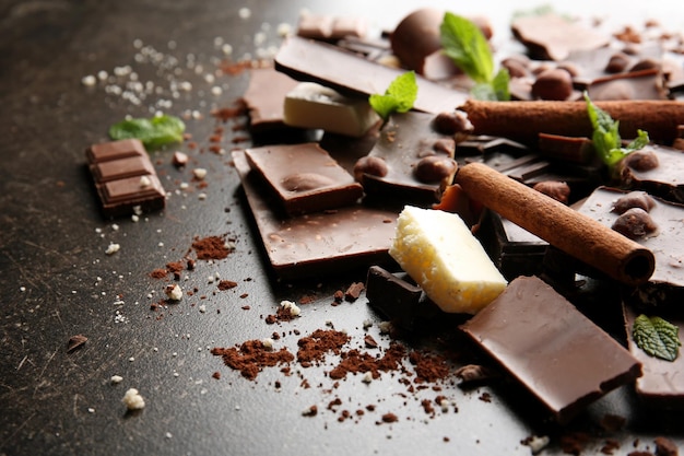 Heap of broken chocolate pieces on table