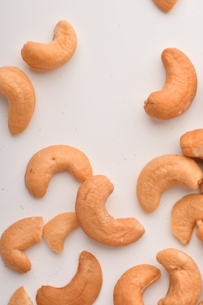 Heap of cashew nuts on white