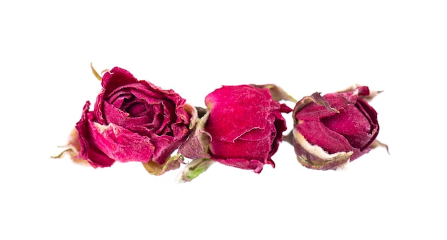 Heap of dry tea roses buds isolated on white background Rose flower tea Phnom Penh rose tea Clipping path