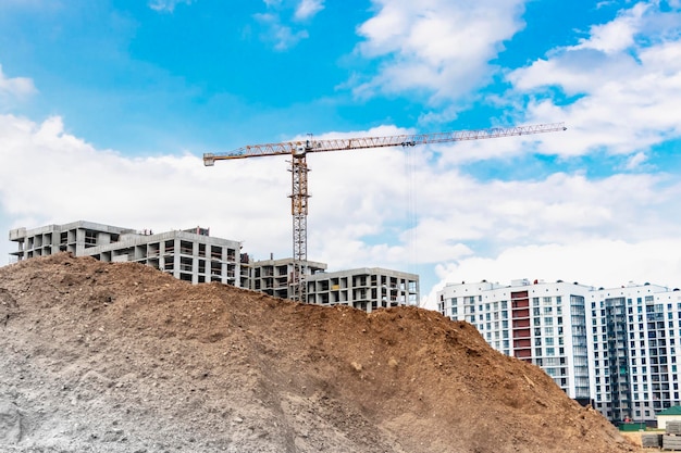 Heap of earth sand and clay at the construction site against the sky Earthworks at the construction site