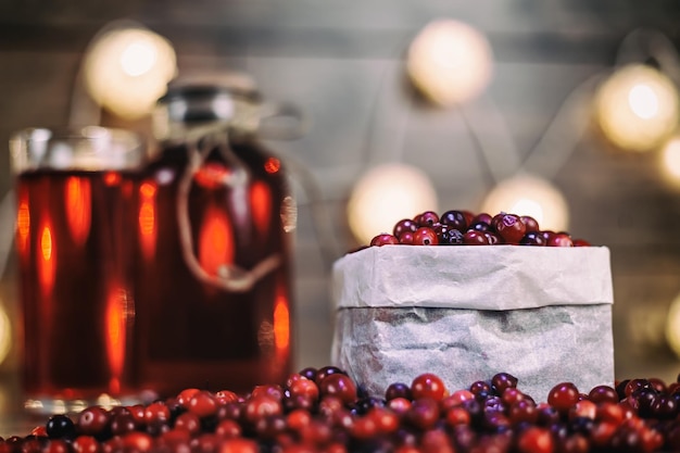 Heap of fresh cranberries on vintage wooden background cranberry juice healthy food