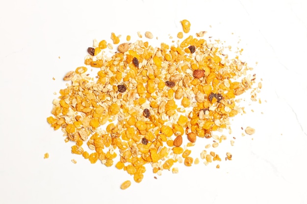 A heap of granola on a white background with copy space