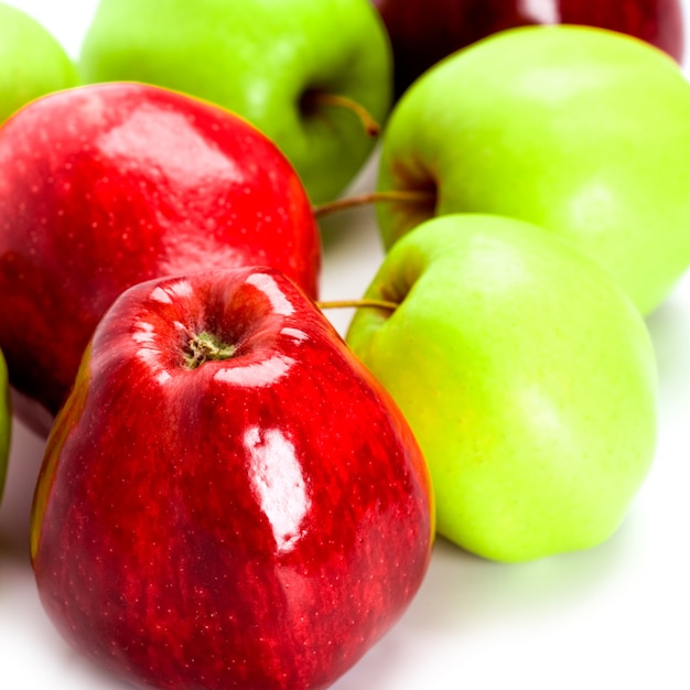 Heap of green and red apples closeup