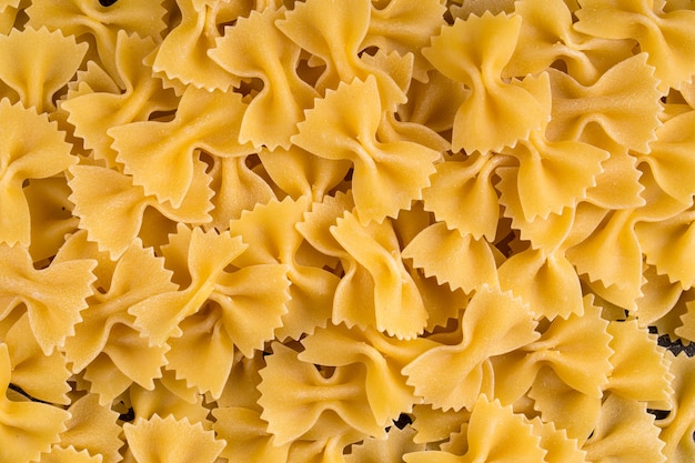 Heap of Italian uncooked farfalle pasta