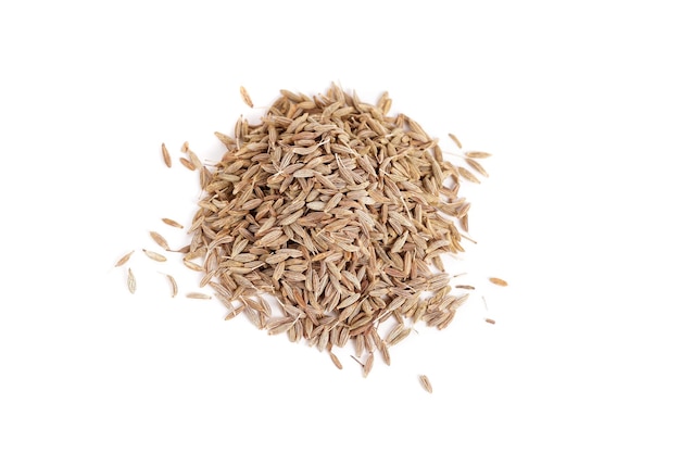 Heap of natural dried cumin isolated on white background