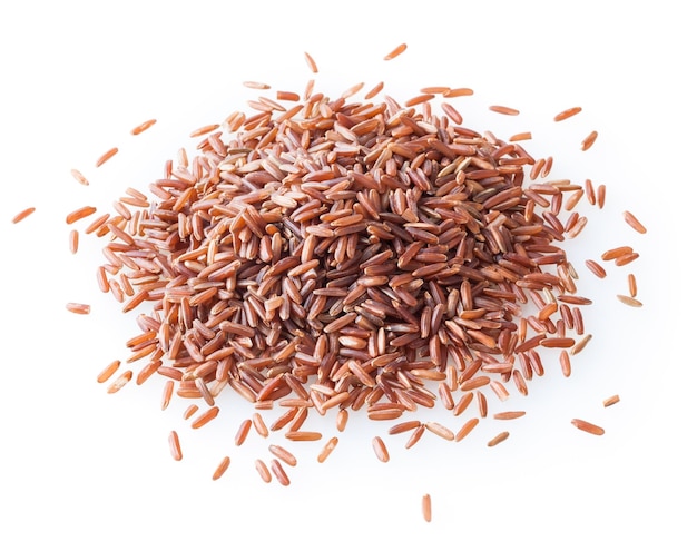 Heap of ncooked red rice isolated on white background