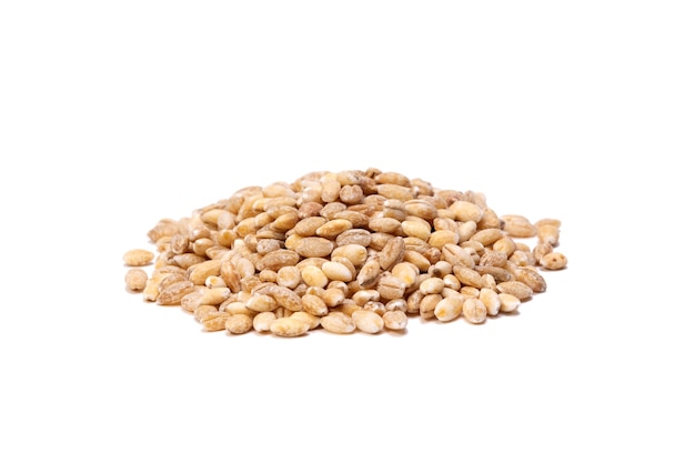 Heap of pearl barley grains isolated on white